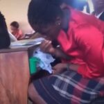 Video: University female student filmed eating a bucket of food in class Video: University female student filmed eating a bucket of food in class