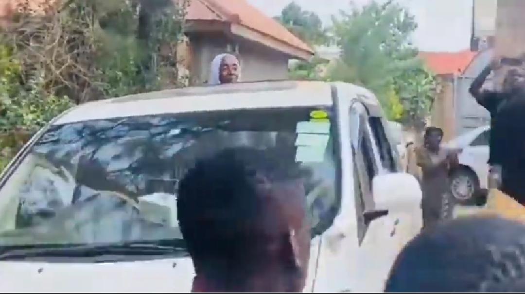 VIDEO: Precious Remmie’s mother arrives in village like queen in open roof car from Mecca